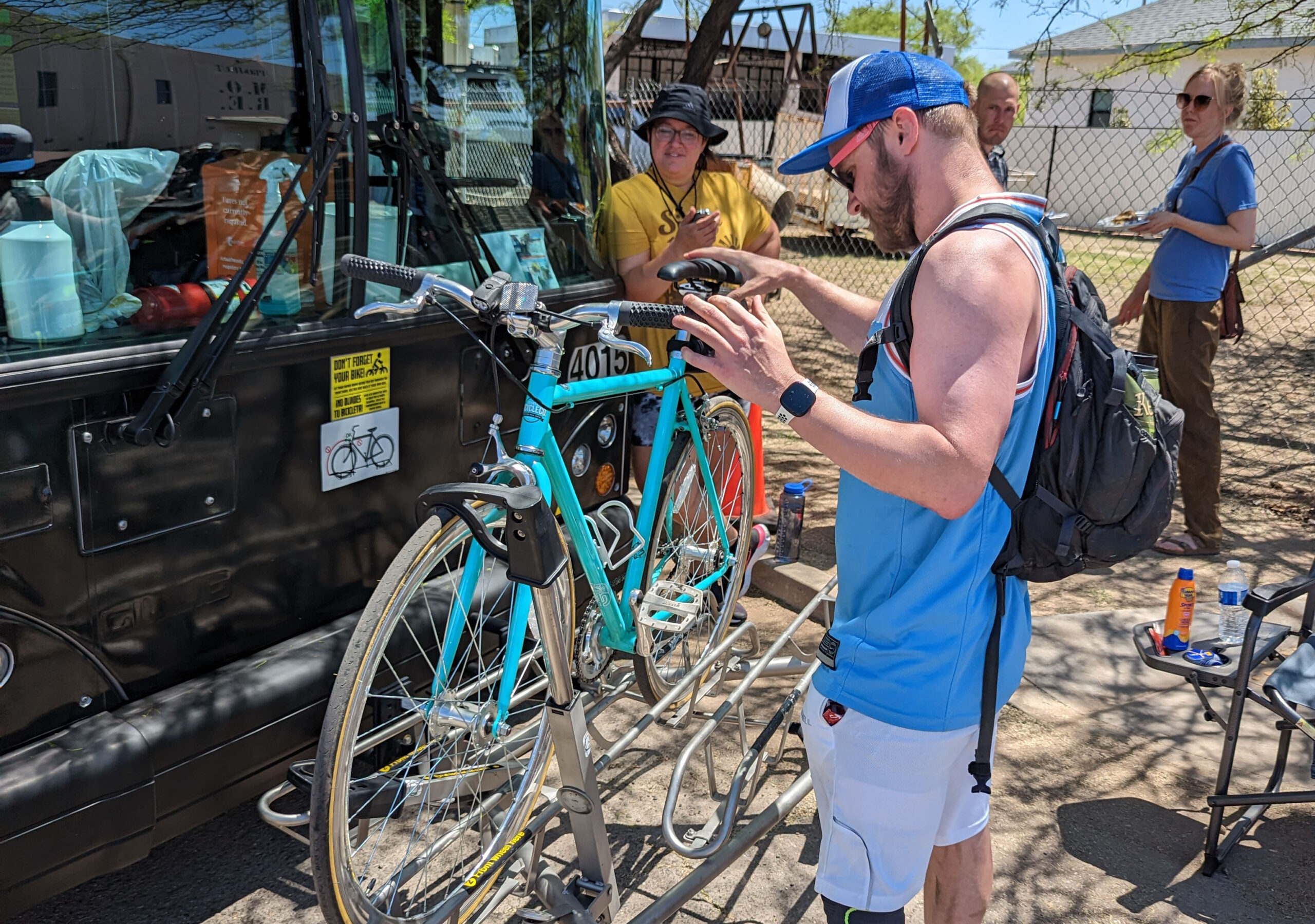 Jason learns how to load his bike onto the front racks of a Sun Tran bus at Cyclovia.